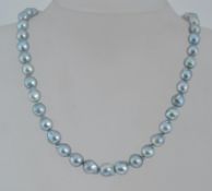 A silver and baroque pearl necklace stru