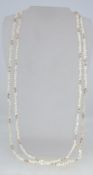 Two pearl necklaces strung with rice pea