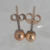 A pair of tested 9ct gold stud earrings
