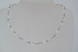 A 925 silver necklace strung with three