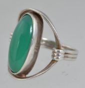 A large silver dress ring set with a cen