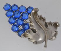 A large vintage white metal brooch pin