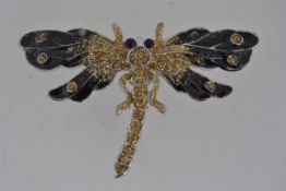 A vintage white metal figural brooch in