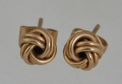 A pair of 9ct gold knot stud earrings w