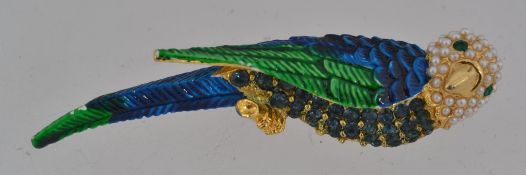 A vintage yellow metal figural brooch in