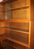 A set of 3 stacking oak lawyers bookcase cabinets of angular form,