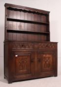 A good quality Jacobean revival oak dresser in the manner of Old Charm.