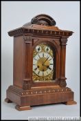 A good 20th century large oak cased English bracket clock with silvered dial,