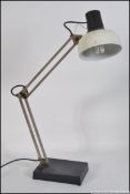 A Vintage 20th century retro LIVAL anglepoise lamp having a white pendant shade and black body