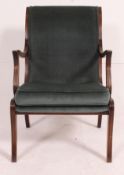 A good quality 20th century Regency revival mahogany armchair raised on sabre supports with shaped