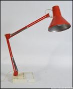 Retro vintage orange anglepoise lamp complete with detachable weighted base all in good order .