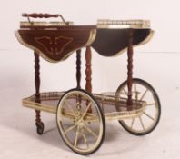 A vintage 20th century Italian floral marquetry effect 2 tier drinks trolley,