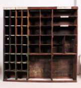 A 20th century vintage purpose built garage sectional pigeon hole / parts storage shelving system,