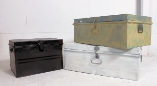 A collection of 3 vintage 20th century metal / tin trunks being black and white,