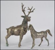 A heavy hollow cast silver plated 12 point stag along with a cast plated horse. Measures: 31cm H.