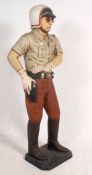 A life sized model of an American law enforcement officer / Highway Patrol,