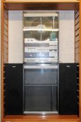 A vintage modular 1970's / 1980's Bush upright audio system 9000 having vertical record player,