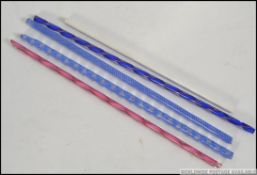 A collection of coloured 20th century Nailsea glass twizzle sticks of varying colours red, blue,
