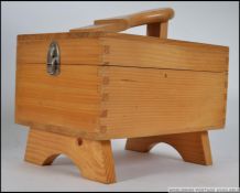 A vintage 20th century shoe shine box with hinged top complete with the contents.