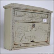 A 20th century metal letter box with decorative hunting scenes facia ( see illustration )