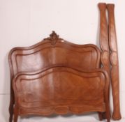 A 19th century French walnut double bed.