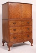 A good quality burr walnut queen anne tallboy chest of drawers raised on cabriole legs with drawers