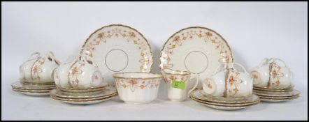 A Victorian chintz pattern part tea service comprising cups, saucers,