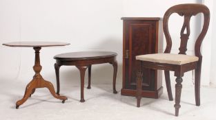A Georgian 19th century mahogany tilt top wine table being raised on splayed legs ( non tilting )