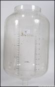 A large 20th century Laval industrial agricultural dairy glass storage bottle having acid etched