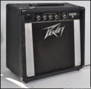 A 20th century Peavey backstage 30 music amp with cable having notation to the front