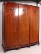 A good quality Edwardian Queen Anne revival mahogany triple wardrobe compactum.