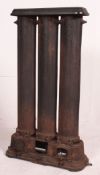 An early 20th century large cast iron architectural radiator with plinth base,