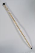 A Chinese sectional 19th / 20th century bone walking cane having applied Chinese characters to the
