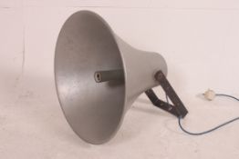 A vintage galvanised metal industrial pendant light of trumpet form being converted from a yard