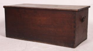 A Victorian pine blanket box having lion mask ring pull carry handles with hinged top over open and