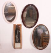 An Edwardian mahogany oval wall mirror together with another similar and also a painted oval mirror