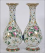 2 Japanese / Chinese baluster vases of medium form having famille rose gold leaf and foliate