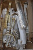 A collection of retro unused new old stock gents and ladies watch strap bracelets