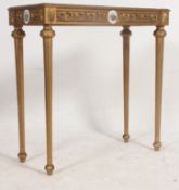 A stunning 19th / 20th century gilt console table, being raised on column legs,