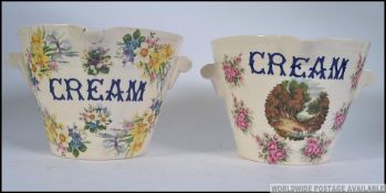 A pair of fabulous Continental pottery twin handled milk pails,