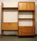 A stunning 1970's retro teak Ladderax modular wall system comprising slatted uprights with fall