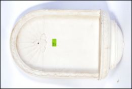 A contemporary Italian style plaster stoop - wall bracket being cast with relief works L57cm