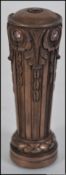 An unusual bronze seal in the form of a pillar inset with semi precious stones