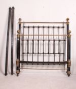 A Victorian large brass and black double bed complete with the runners.