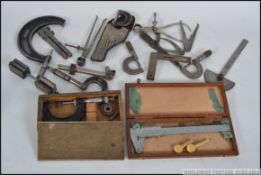 A collection of vintage engineers tools to include Micrometers, Vernier gauges etc.
