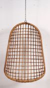 A 20th century Rattan weave swing egg chair in the manner of a retro vintage 1960's original set to