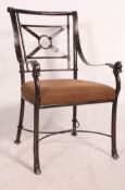 A 20th century metal strap work Georgian revival armchair.