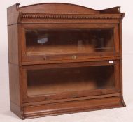 An Edwardian oak twin stacking lawyers / barristers bookcase by Lebus.