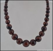 A stunning silver clasp Tigers Eye graduating agate bead necklace.