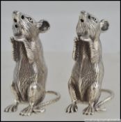 A pair of sterling silver condiments / cruet set in the form of mice,